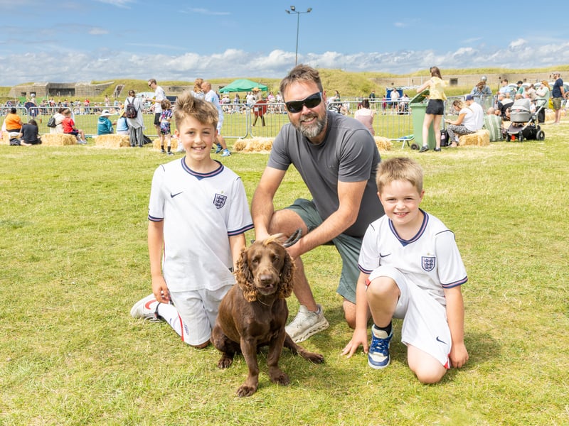 Pictured: (from left) Oliver, Damien - dad, Harry Jarvis and cocker spaniel