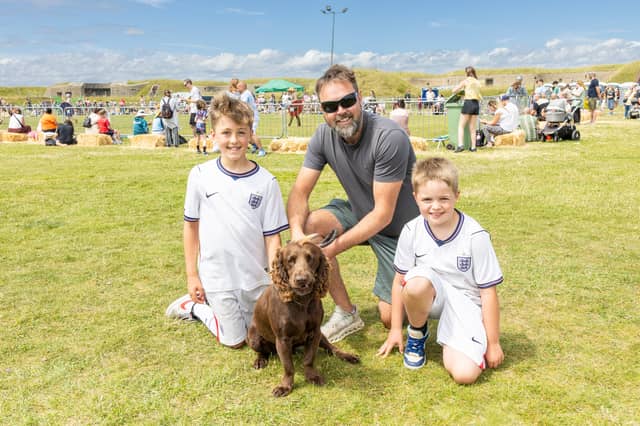 Pictured: (from left) Oliver, Damien - dad, Harry Jarvis and cocker spaniel