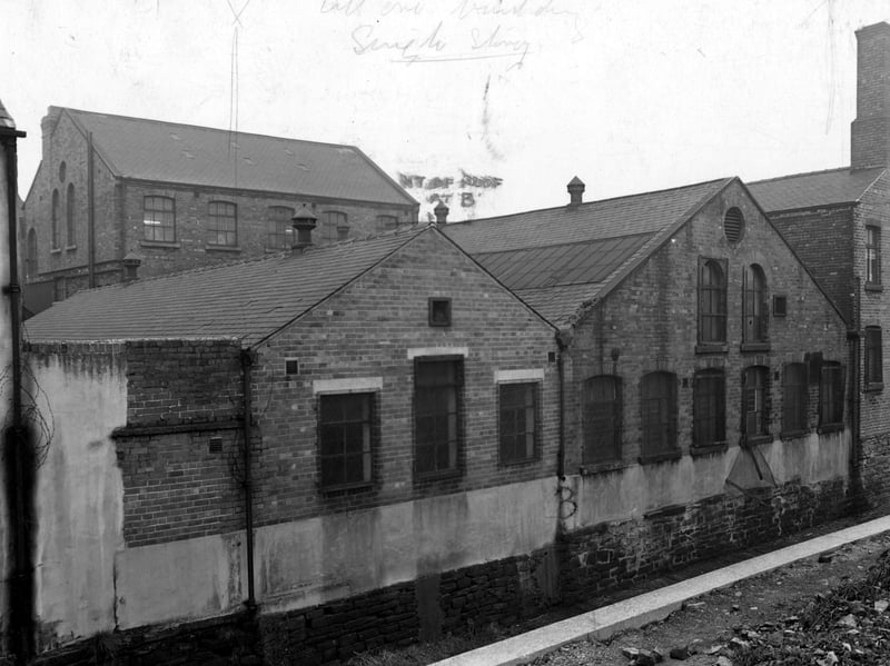 The rear of Goodyear Tyre and Rubber Co Ltd at 9 Sheepscar Grove, seen from Sheepscar Street building site. Pictured in November 1953.