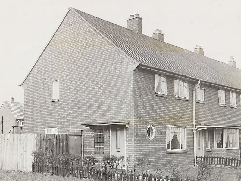 Number 32 Tintern Way in Mossley stands proud in 1963, representing a major civic achievement for Bloxwich and the wider borough. Completed in 1958, the property earned a special place in local history as Walsall Corporation's 15,000th council house. Featuring neat gardens, decorative porthole windows, and modern brickwork, the home stood as a shining symbol of post-war housing expansion, providing bright, comfortable living spaces for growing families across the area. Did you move into one of the new council estates in Bloxwich or Mossley during this era of housebuilding?