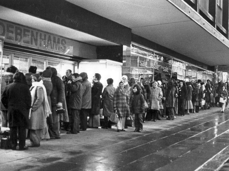 Shoppers queue for the start of the sale at Debenhams on The Moor, Sheffield, on December 27, 1979