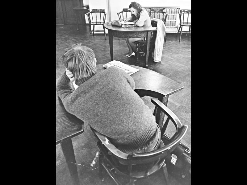 Student Ann Taylor concentrates intently on her coursework in a quiet study room at Wulfrun College in 1969. Enrolled on a chemical technicians course, her studies reflect an era when further education was expanding rapidly, opening up technical career pathways for young women and men across the region. The image offers a nostalgic glimpse into campus life during the late 1960s, capturing the dedication of students preparing to enter Wolverhampton's bustling industrial and scientific workforce. Did you or anyone in your family study at Wulfrun College during the 1960s or 1970s?
