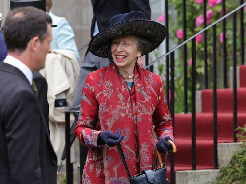Princess Anne speaking to guests during the Garden Party in the gardens of the Palace of Holyroodhouse 