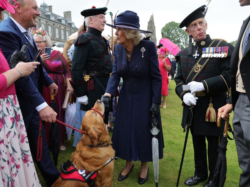 Queen Camilla speaking to guests during a Garden Party in the gardens of the Palace of Holyroodhouse in Edinburgh, as part of the King's visit to Scotland for Holyrood Week. 