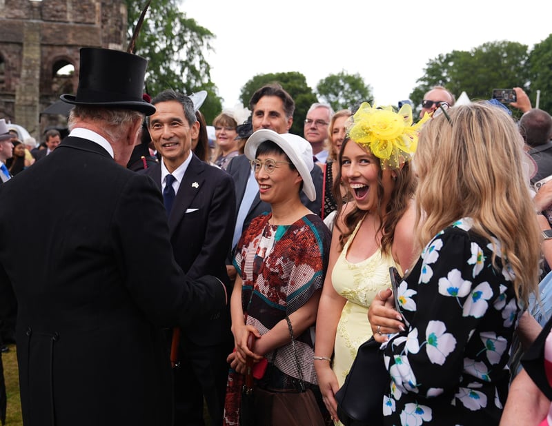 King Charles III speaks with guests during a Garden Party in the gardens of the Palace of Holyroodhouse in Edinburgh, as part of the King's visit to Scotland for Holyrood Week.