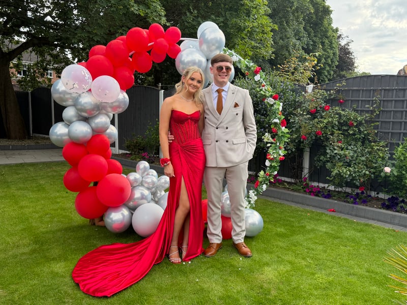 Daisy Minto in a stunning red gown.