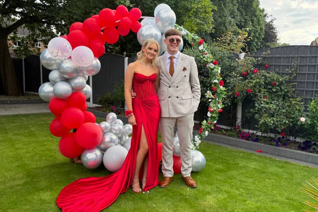 Daisy Minto in a stunning red gown.