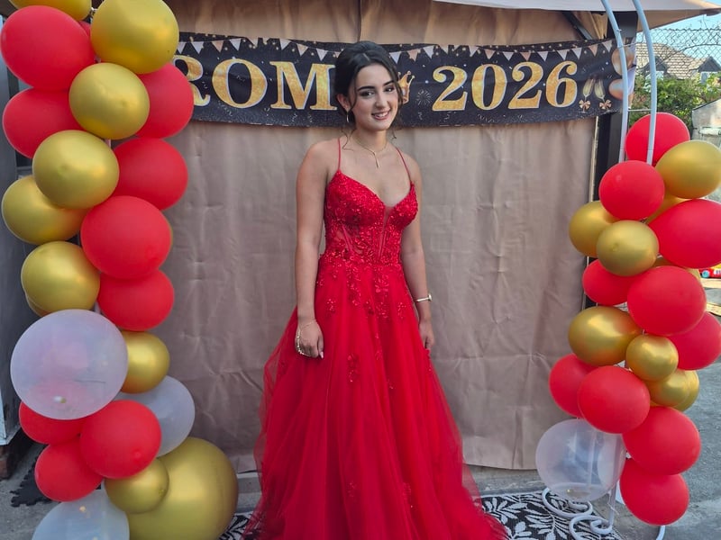 Paulina Kennedy shared this photo of a young woman in a red dress. 