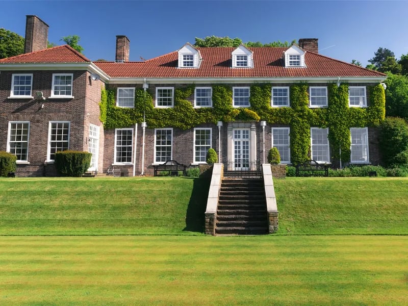 Eight bedrooms, five bathrooms, 7,308 sq ft.