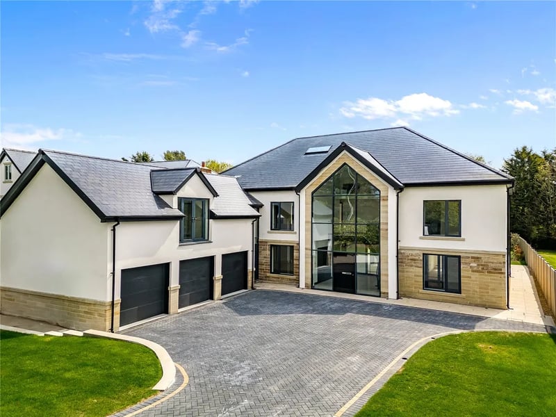 Six bedrooms, seven bathrooms, 6,963 sq ft.