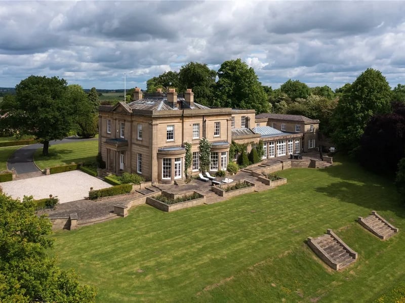 Eight bedrooms, six bathrooms, 14,244 sq ft.