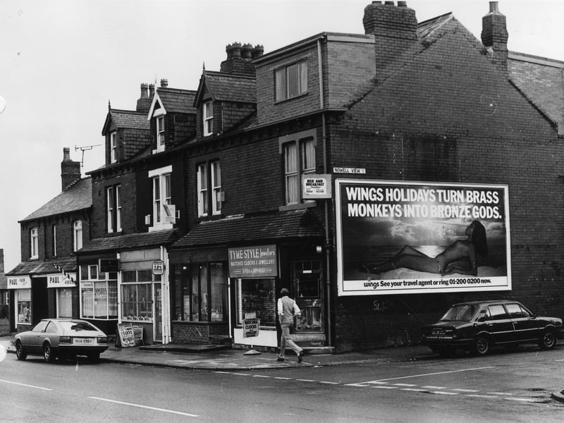 Harehills Lane in March 1982 showing a row of shops numbered (from right) 444 to 452. These include Tyme Style Jewellers, Anglia Building Society and Paul, hair stylist. The junction with Nowell View is on the right.