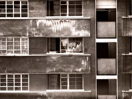Close up of part of Quarry Hill Flats at the time that much of the site was in the process of demolition in 1977. It would appear that at least one of the flats here is still occupied, with clothes seen hanging in the balcony.