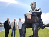 Artist Sean Henry, with Galway International Arts Festival's Paul Fahy and John Crumlish at the Middle Arch, Claddagh, with Sean's Seated Figure, part of his festival show Presence. 