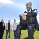 Artist Sean Henry, with Galway International Arts Festival's Paul Fahy and John Crumlish at the Middle Arch, Claddagh, with Sean's Seated Figure, part of his festival show Presence. 