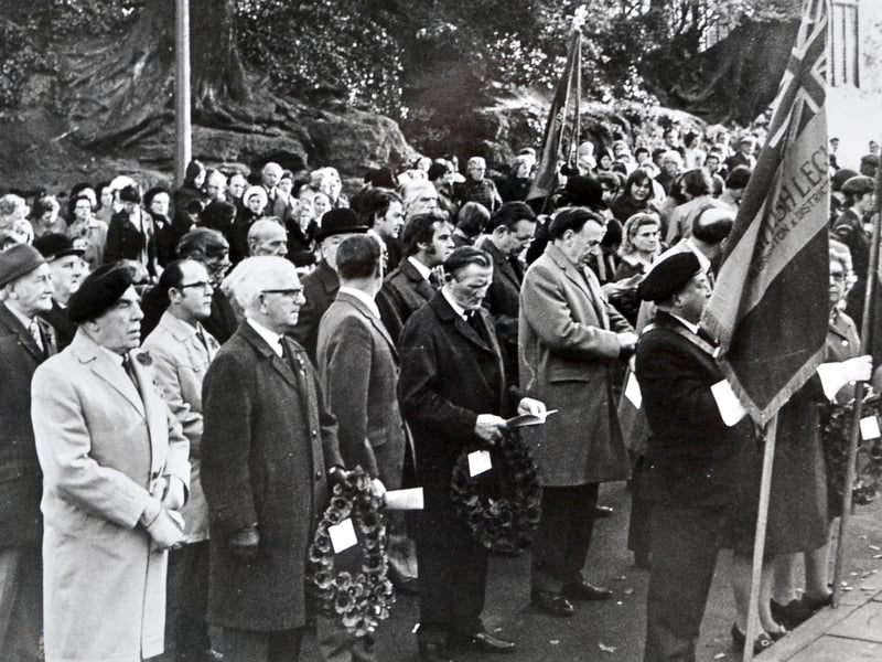 The Albrighton & District Royal British Legion leads the Remembrance parade in this 1975 photograph. With the village streets lined for Armistice Day, this scene captures a familiar tradition of community and remembrance. Do you recognise the pub in the background or remember taking part in the parade?
