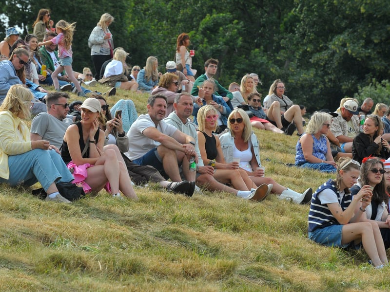 Festival goers take their seats on Hill 60