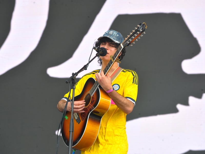 Jason Alon wearing a Leeds United shirt on stage on day two