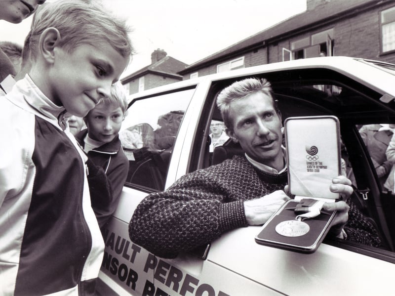 Peter Elliott, of Rotherham, shows off the 1500m silver medal he won at the 1988 Olympics in Seoul