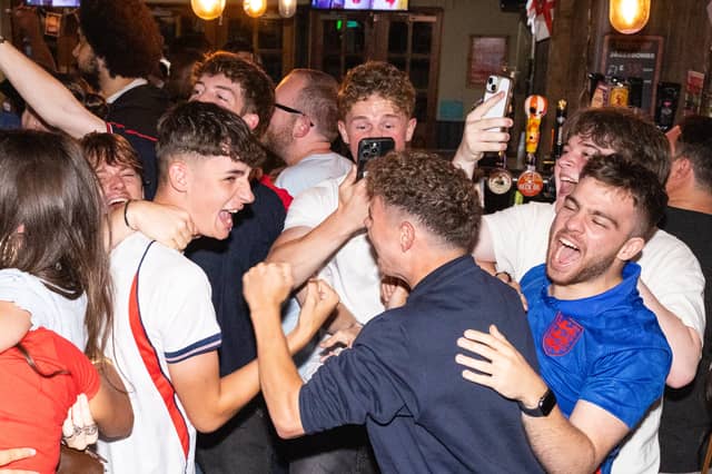 England fans rejoice after Harry Kane scores his second half penalty.
