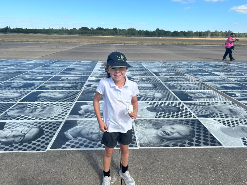 Children were very excited to find their photos on the runway. 