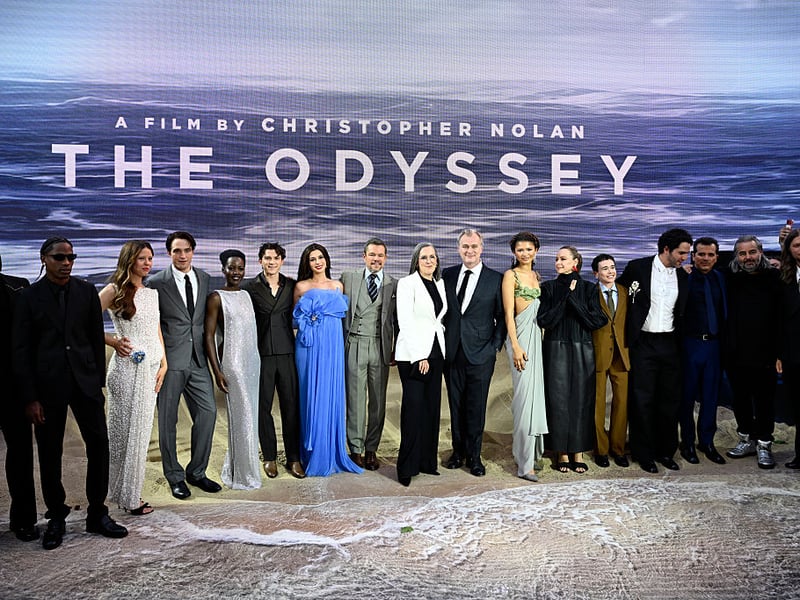 The cast and crew of 'The Odyssey' at the premiere (left-right) Himesh Patel, Travis Scott, Mia Goth, Robert Pattinson, Lupita Nyong'o, Tom Holland, Anne Hathaway, Matt Damon, Emma Thomas, Christopher Nolan, Zendaya, Samantha Morton, Elliot Page, Benny Safdie, John Leguizamo, Hoyte van Hoytema and Ludwig Göransson.