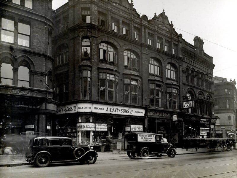 Boar Lane in September 1936. Number 52 Jacomelli's Restaurant advertising 'Oysters fresh daily'. Next on the corner with Albion Square is A. Davy and Sons Ltd, grocers. At number 55 is Thomas Cook and Son with the entrance to the York Cafe next to it.