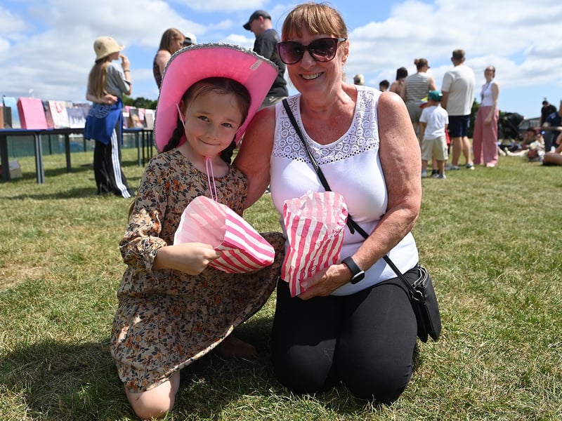 One cow girl enjoying her sweets in a pink hat