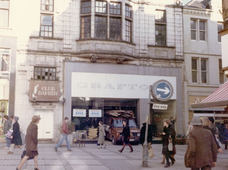 Numbers 16-17 Kirkgate, formerly occupied by Grafton's, now closed down. This was shortly to be taken over by Thrifty Clothes. Club Damien nightclub occupies the upper storey, with an entrance on the right. Pictured in February 1983.