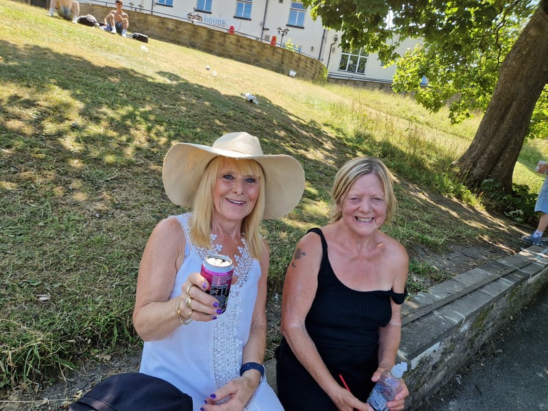 Sisters Jayne Howarth and and Ange Ellis enjoy refreshing drinks to cool down in Crookes Valley Park. Photo: David Kessen, Iconic Media