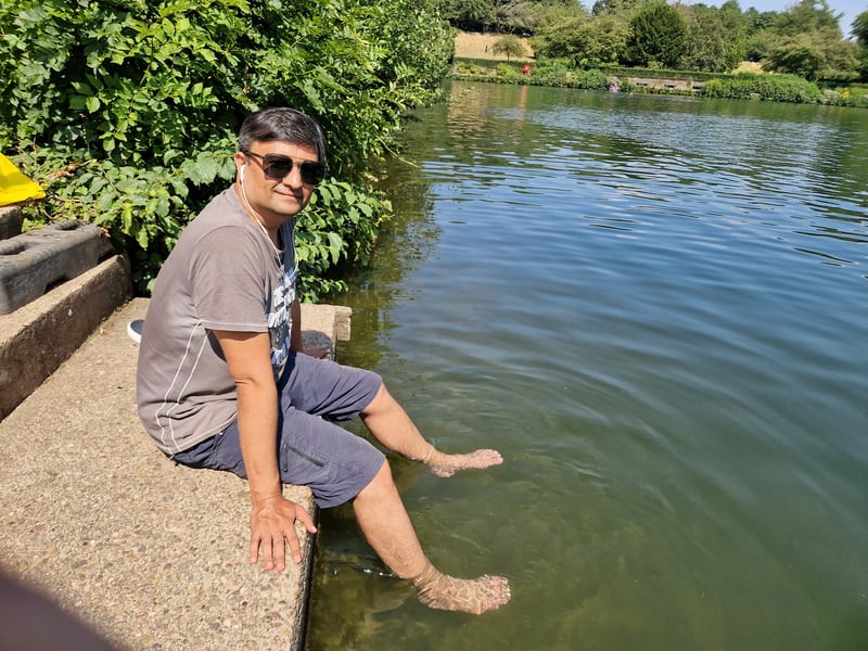 A man cools his feet in the lake at Crookes Valley park as Sheffield sizzles. Photo: David Kessen, Iconic Media