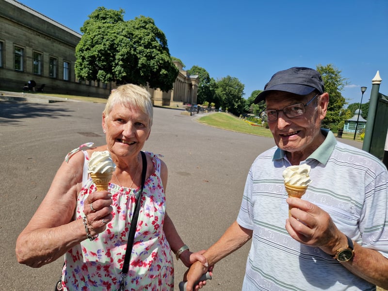 A couple cool off with ice creams at Weston Park, Sheffield. Photo: David Kessen, Iconic Media
