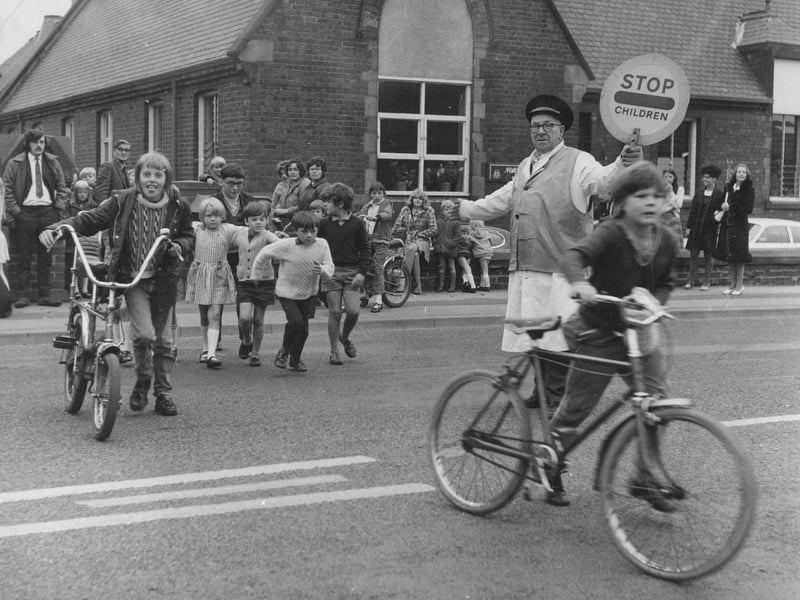 A child with a chopper bike crosses the road in Castleford in September 1972