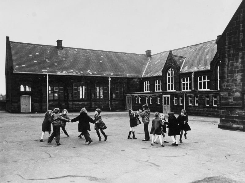 Children in the playground at Armley CofE School, Wesley Road, Armley, Leeds, in January 1974