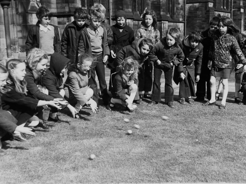 Pupils at Lee Green School, Mirfield, enjoy the traditional pastime of egg rolling in March 1975