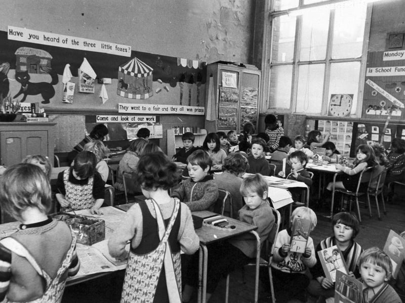 Pupils in a crowded classroom at Castleton Primary School, Leeds, in January 1974, with paint peeling from the walls