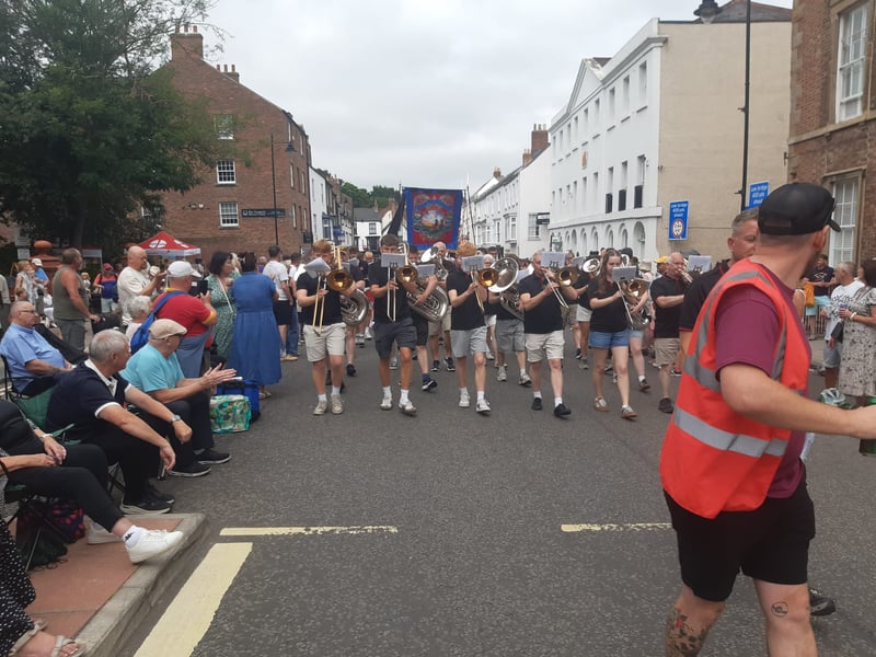 The traditional colliery bands marching through the street.