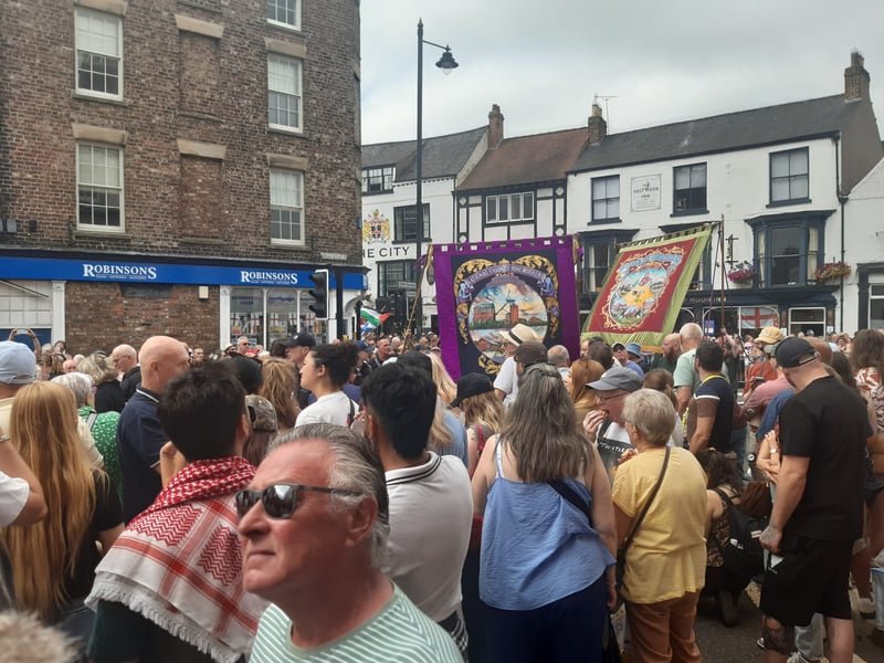The banners and marchers created a colourful scene in the city centre.
