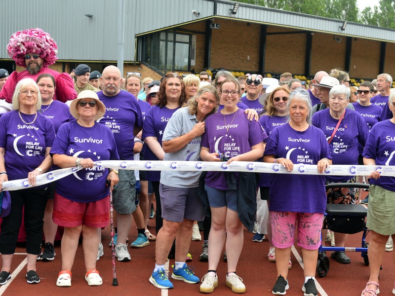 Participants ready to cut the start line ribbon for one last time.