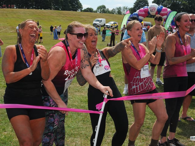 Runners cheer on their friends at the Pretty Muddy event at Temple Newsam