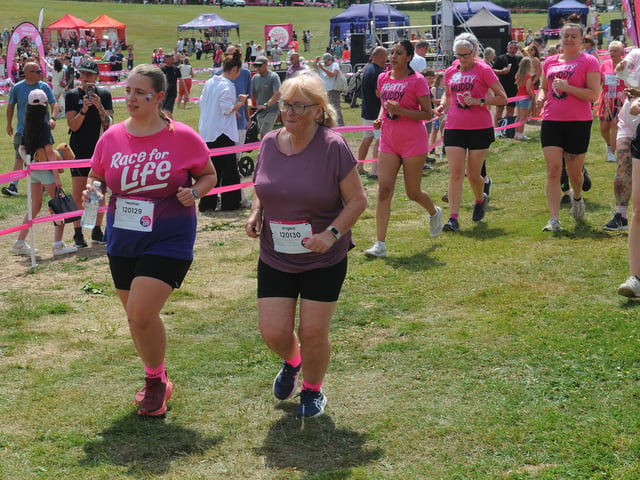 Runners taking part in the Pretty Muddy 5k in aid of Cancer Research UK at Temple Newsam.