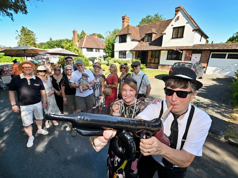 Castlecroft Gardens in Wolverhampton, a very unique street, and a special street party to mark 100 years of the street.  Fancy dress: Front: Donna Watson and Anthony Harris.