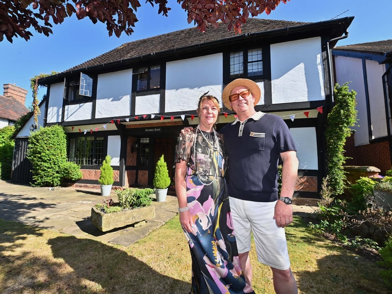 Castlecroft Gardens in Wolverhampton, a very unique street, and a special street party to mark 100 years of the street.  Donna and Ian Watson outside there house, and a pic of builder Major Hutchinson and there house being built.