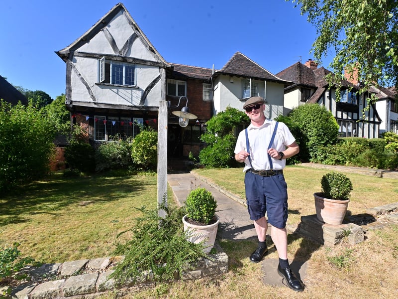 Castlecroft Gardens in Wolverhampton, a very unique street, and a special street party to mark 100 years of the street.  Dave Rowe outside his house.
