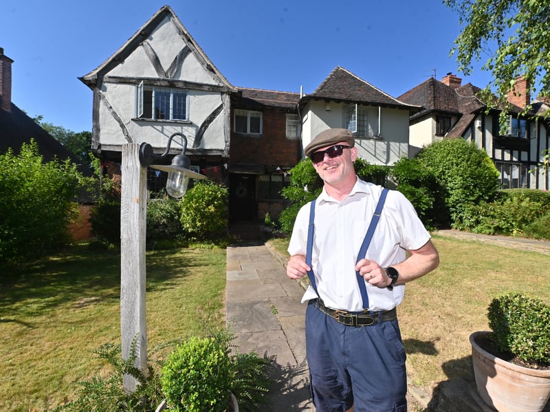 Castlecroft Gardens in Wolverhampton, a very unique street, and a special street party to mark 100 years of the street.  Dave Rowe outside his house.