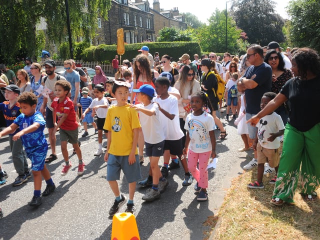 The parade winds its way through Kirkstall yesterday.