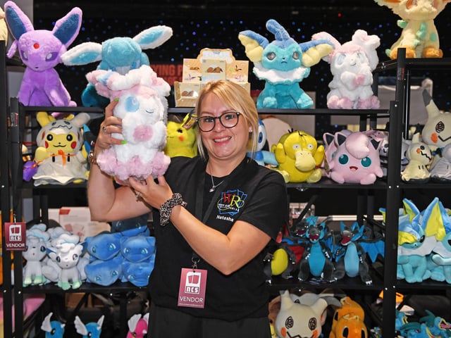 Pictured trader Natasha Ayling on her stall holding Sylveon cuddly toy. 
