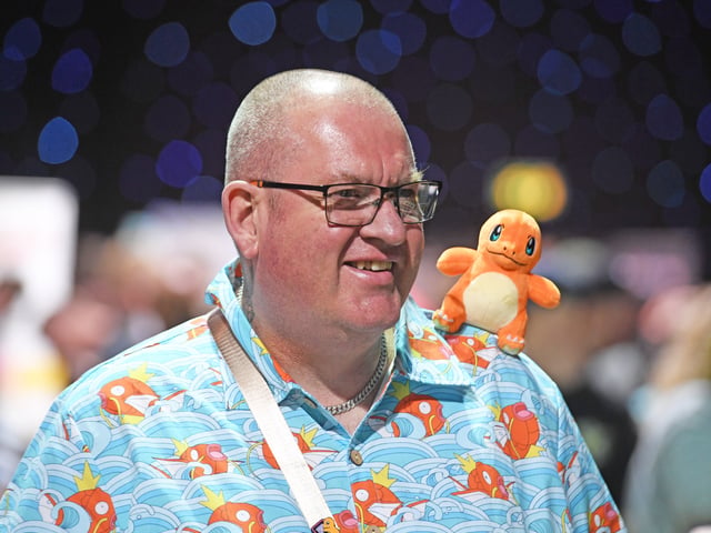 Pictured a visitor to the show with a Charmander friend on his shoulder.