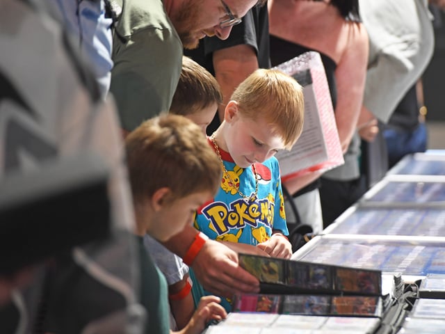 Pictured young collectors view the cards for sale at Leeds Card show at the Royal Armouries. 