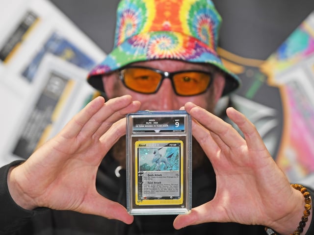 Pictured Sam Lovelady with Absol Pokemon card